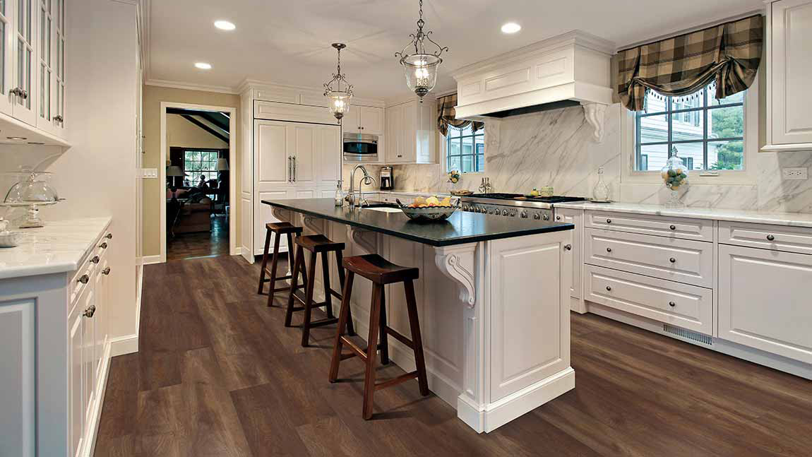 Luxury vinyl planks in a kitchen, installation services available.