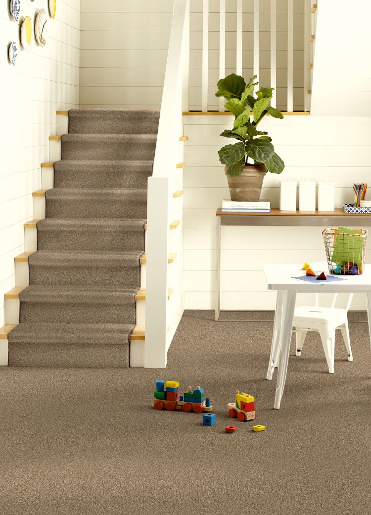 grey stair runner in a Texas entry stairway
